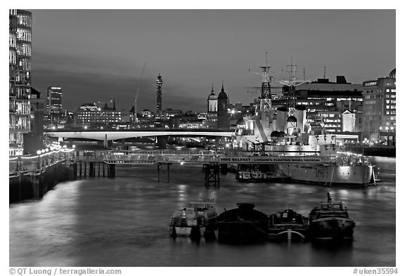 HMS Belfast, London Bridge, and Thames at night. London, England, United Kingdom