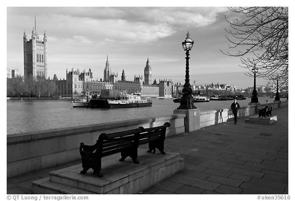 Riverfront promenade, Thames River, and Westminster Palace. London, England, United Kingdom (black and white)