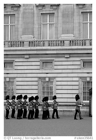 Guards marching during the changing of the Guard, Buckingham Palace. London, England, United Kingdom (black and white)
