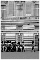 Guards marching during the changing of the Guard, Buckingham Palace. London, England, United Kingdom ( black and white)