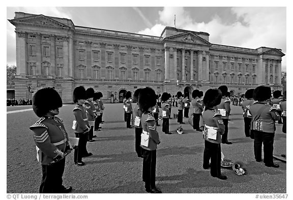 Rows of guards  wearing bearskin hats and red uniforms. London, England, United Kingdom (black and white)