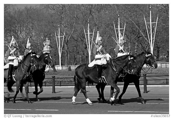 Horse guards riding near Buckingham Palace. London, England, United Kingdom (black and white)