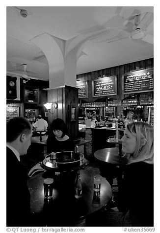 Talking around a drink in the pub Westmister Arms. London, England, United Kingdom (black and white)