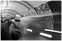 People and train in motion, London underground. London, England, United Kingdom ( black and white)