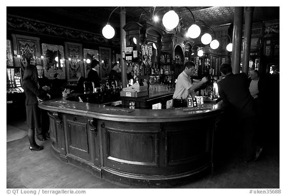 Pouring beer from hand-pulled pump, pub Princess Louise. London, England, United Kingdom (black and white)