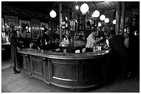 Pouring beer from hand-pulled pump, pub Princess Louise. London, England, United Kingdom ( black and white)