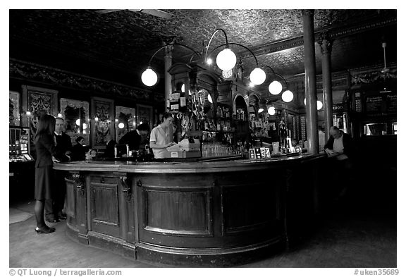 Central horseshoe bar in the 19th century victorian  pub Princess Louise. London, England, United Kingdom (black and white)