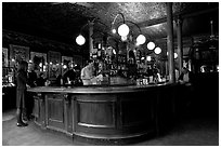 Central horseshoe bar in the 19th century victorian  pub Princess Louise. London, England, United Kingdom (black and white)