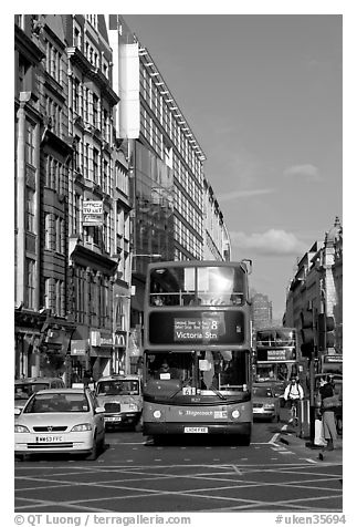Double decker busses in a busy street. London, England, United Kingdom (black and white)