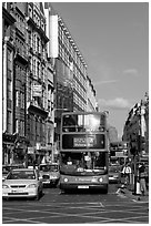 Double decker busses in a busy street. London, England, United Kingdom ( black and white)