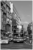 Double decker busses in a busy street. London, England, United Kingdom (black and white)