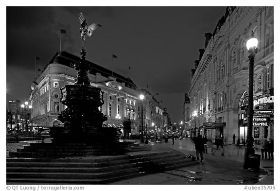 Eros statue and streets at dusk, Picadilly Circus. London, England, United Kingdom