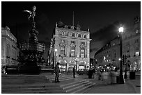 Piccadilly Circus and Eros statue at night. London, England, United Kingdom (black and white)