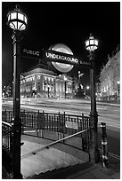 Underground  entrance and lights from traffic at night, Piccadilly Circus. London, England, United Kingdom (black and white)