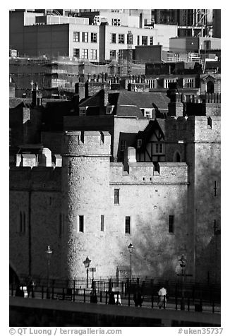 Tower of London and jumble of modern buildings in the background. London, England, United Kingdom