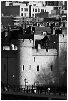 Tower of London and jumble of modern buildings in the background. London, England, United Kingdom ( black and white)