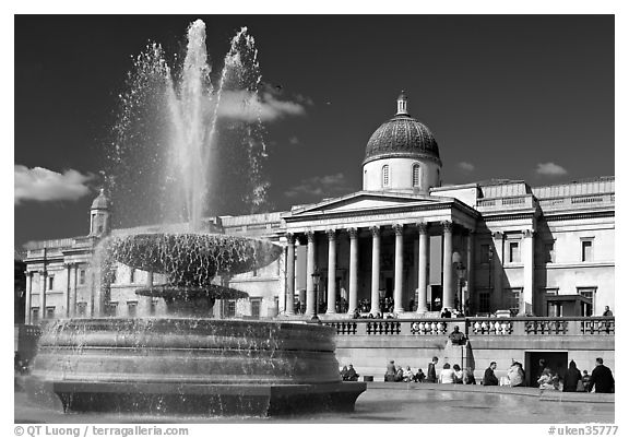 Fountain and National Gallery, Trafalgar Square, mid-day. London, England, United Kingdom (black and white)