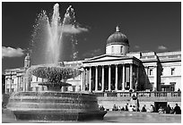 Fountain and National Gallery, Trafalgar Square, mid-day. London, England, United Kingdom (black and white)