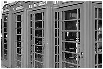 Row of Red phone booths. London, England, United Kingdom ( black and white)