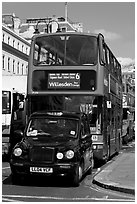 Taxi and double decker bus. London, England, United Kingdom (black and white)