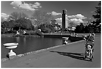 Woman pushing stroller next to the lake. Kew Royal Botanical Gardens,  London, England, United Kingdom ( black and white)