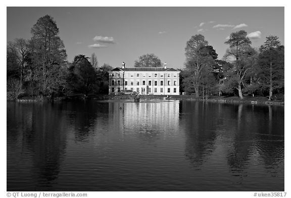 Museum No 1 reflected in lake, late afternoon. Kew Royal Botanical Gardens,  London, England, United Kingdom