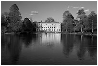 Museum No 1 reflected in lake, late afternoon. Kew Royal Botanical Gardens,  London, England, United Kingdom (black and white)