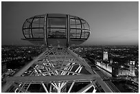Millenium Wheel capsule and Houses of Parliament at dusk. London, England, United Kingdom (black and white)