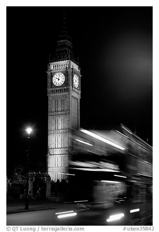 Double-decker bus in motion and Big Ben at night. London, England, United Kingdom