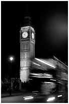 Double-decker bus in motion and Big Ben at night. London, England, United Kingdom (black and white)
