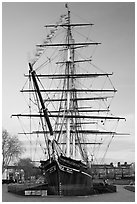 Cutty Sark with wind blowing upon flags. Greenwich, London, England, United Kingdom (black and white)