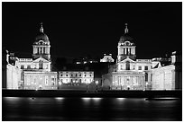 Old Royal Naval College, Queen's house, and Royal observatory with laser marking the Prime meridian at night. Greenwich, London, England, United Kingdom (black and white)