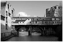 Pulteney Bridge, one of only four bridges in the world with shops across the full span on both sides. Bath, Somerset, England, United Kingdom ( black and white)