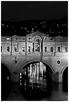 Central section of Pulteney Bridge, covered by shops,  at night. Bath, Somerset, England, United Kingdom ( black and white)