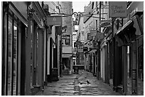 Shops lining narrow street. Bath, Somerset, England, United Kingdom (black and white)