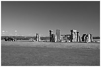 Large group of tourists looking at the megaliths, Stonehenge, Salisbury. England, United Kingdom (black and white)