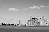 Large group of tourists looking at the standing stones, Stonehenge, Salisbury. England, United Kingdom ( black and white)