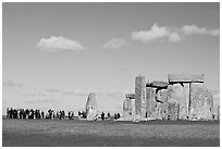 Large group of tourists looking at the standing stones, Stonehenge, Salisbury. England, United Kingdom (black and white)