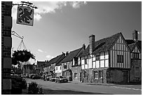 One of the four main streets  of National Trust village of Lacock. Wiltshire, England, United Kingdom (black and white)