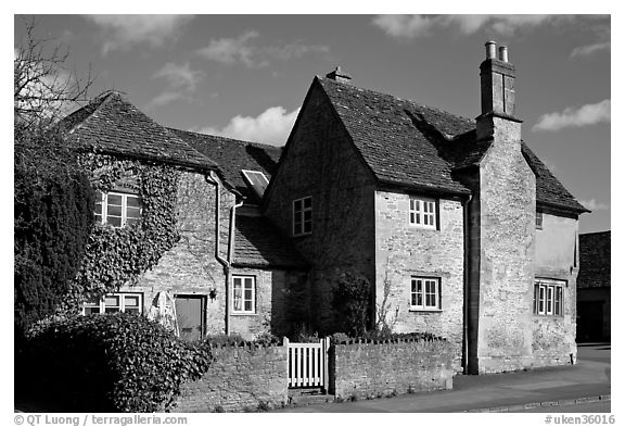 Houses with roofs made from split natural stone tiles, Lacock. Wiltshire, England, United Kingdom (black and white)