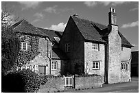 Houses with roofs made from split natural stone tiles, Lacock. Wiltshire, England, United Kingdom ( black and white)