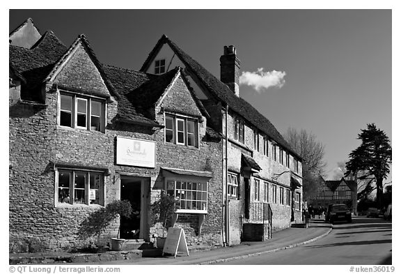 Street lined with stone houses, Lacock. Wiltshire, England, United Kingdom (black and white)