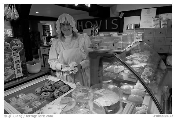 Baker wearing old-fashioned attire, Lacock. Wiltshire, England, United Kingdom