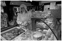 Baker wearing old-fashioned attire, Lacock. Wiltshire, England, United Kingdom (black and white)