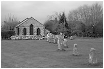 Small standing stones and chapel, Avebury, Wiltshire. England, United Kingdom (black and white)