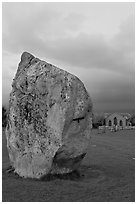 Standing stone and chapel at dusk, Avebury, Wiltshire. England, United Kingdom ( black and white)