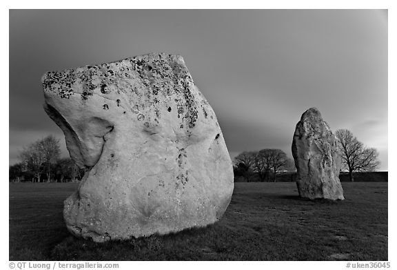 Large standing stones and brewing storm at dusk, Avebury, Wiltshire. England, United Kingdom