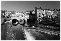 Weir on the Avon River and Pulteney Bridge. Bath, Somerset, England, United Kingdom (black and white)