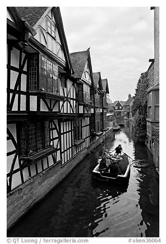 Half-timbered house, canal, and rowboat. Canterbury,  Kent, England, United Kingdom (black and white)