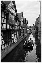 Half-timbered house, canal, and rowboat. Canterbury,  Kent, England, United Kingdom ( black and white)